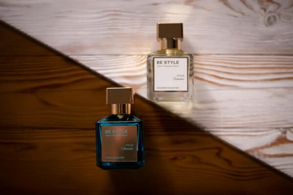 Stylish perfume bottles displayed on a textured wooden background for a modern look.